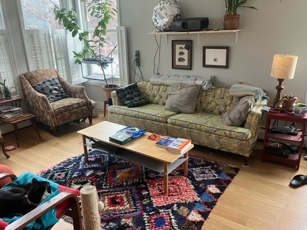 A quiet one-bedroom condo with a finished basement with a large window and separate half-bathroom.